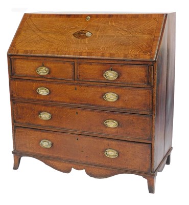 Lot 496 - A George III oak bureau, with mahogany...
