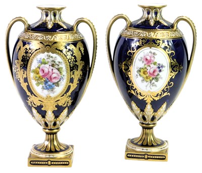 Lot 575 - A pair of Royal Crown Derby twin-handled...
