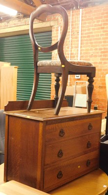 Lot 1021 - An oak three-drawer chest, a Victorian balloon...