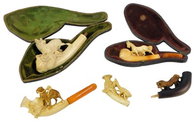 Lot 554 - A group of Meerschaum carved pipes, to include...