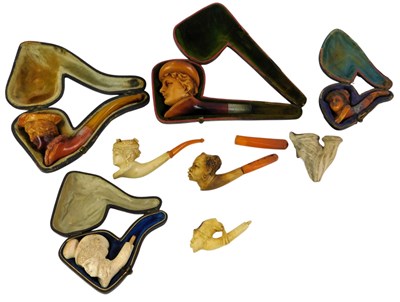 Lot 556 - Various Meerschaum pipes, each carved with a...