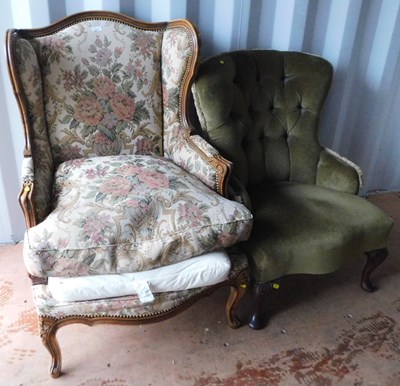 Lot 1071 - A wingback wooden framed armchair, on cabriole...