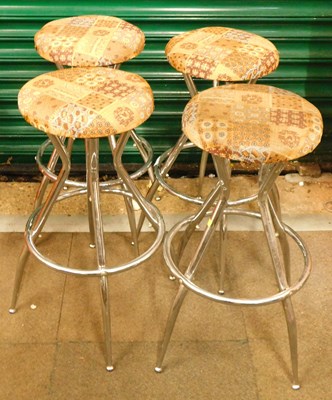 Lot 1039 - A set of four chrome based with upholstered...