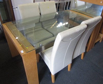 Lot 1055 - A dining table, glass topped, wooden bases,...