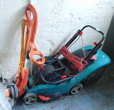 Lot 1085 - A Flymo Contour S strimmer, and a Bosch...