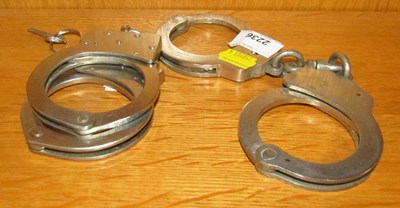 Lot 2236 - A pair of Hiatt handcuffs, and another pair...