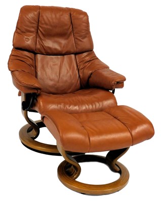 Lot 585 - A Stressless armchair, upholstered in tan...