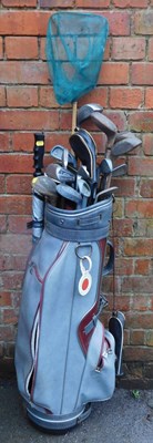 Lot 1070B - A golf bag containing various clubs.