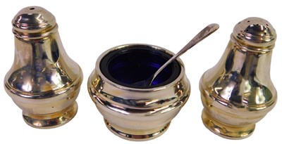 Lot 589 - An Elizabeth II silver three piece condiment...