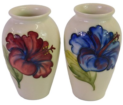 Lot 604 - A Moorcroft pottery Red Hibiscus pattern vase,...