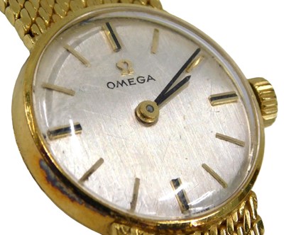 Lot 1 - An Omega ladies 18ct gold wristwatch, the...