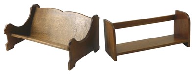 Lot 117 - An oak book rack, the sides inlaid with a...