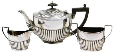 Lot 16 - An Edwardian silver three piece tea set, each...