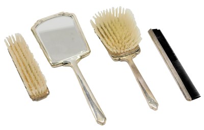 Lot 23 - An Elizabeth II silver four piece dressing...