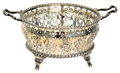 Lot 35 - A George V silver two handled basket, with...