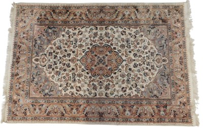 Lot 516a - A Pakistani pink ground rug, with central...