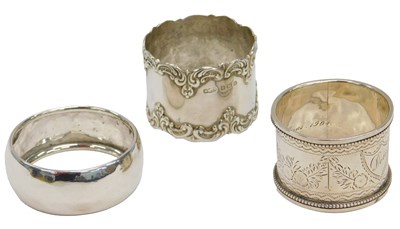 Lot 352 - Three various silver napkin rings, two with...