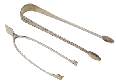 Lot 359 - A pair of silver wishbone shaped novelty sugar...