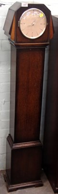 Lot 1502 - A 1930s oak cased grandmother clock, the...