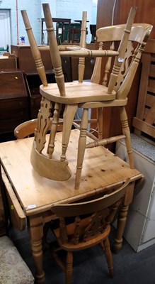 Lot 1504 - A pine drop leaf kitchen table, the top with a...