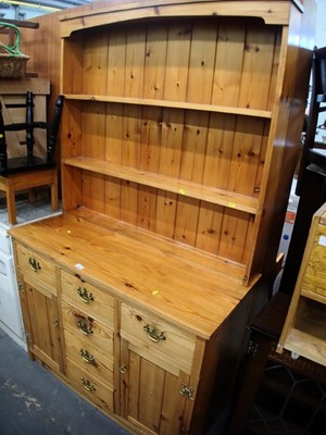 Lot 1506 - A 20thC pine dresser, the top with three...