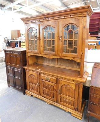 Lot 1511 - An oak Old Charm style drinks cabinet, the top...