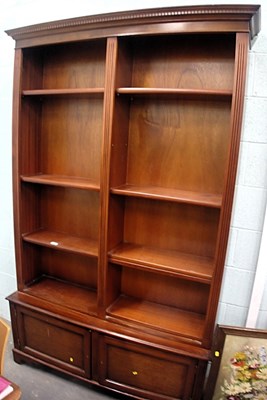 Lot 1516 - A 20thC mahogany bookcase, the top with a...