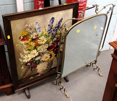 Lot 1518 - An early 20thC brass framed fire screen, with...