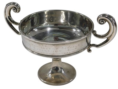 Lot 687 - A silver two handled trophy cup, with...