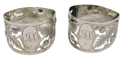Lot 689 - A George V silver D shaped napkin rings, each...