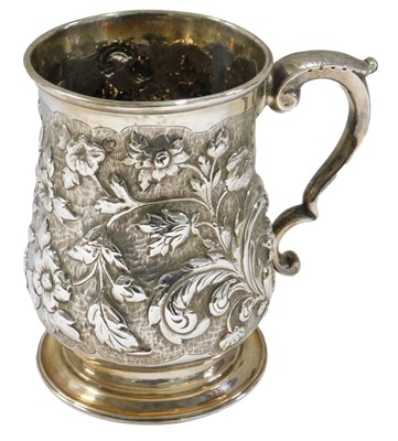 Lot 674 - A George III silver baluster shaped mug, later...
