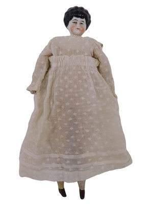 Lot 732 - A German porcelain doll, with ceramic feet.