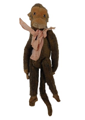 Lot 734 - A plush covered early 20thC toy monkey, 23cm...