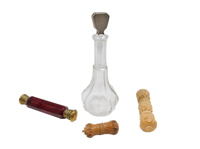 Lot 758 - A ruby tinted glass and brass double ended...