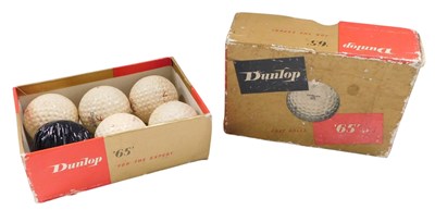 Lot 779 - Five Dunlop 65 golf balls, one golf ball in...