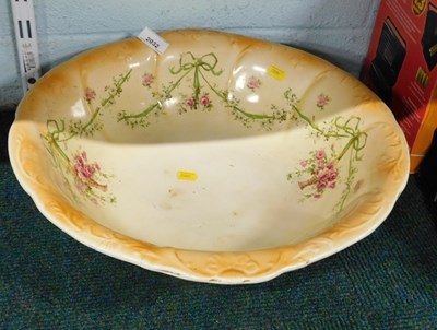 Lot 2032 - An early 20thC pottery wash bowl, decorated...