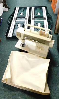 Lot 2078 - A Singer Excelle sewing machine, together with...