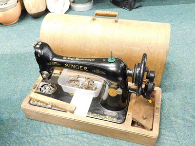 Lot 2085 - An oak cased Singer sewing machine.