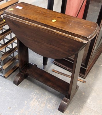 Lot 1539 - A stained pine drop leaf side table, 63cm high,...
