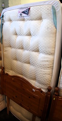 Lot 1560 - A single bed, with mattress and pine headboard,...