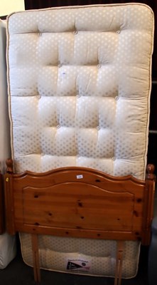 Lot 1561 - A single bed, with mattress and pine headboard,...