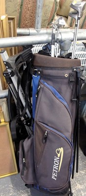 Lot 1568 - A Petron golf bag, containing a selection of...