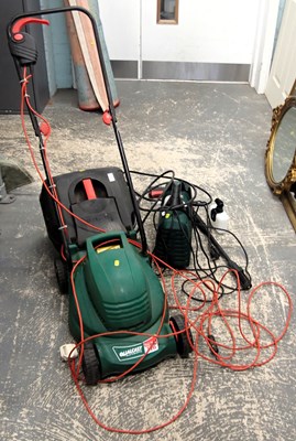 Lot 1572 - A Qualcast Easytrack 320 electric lawn mower,...