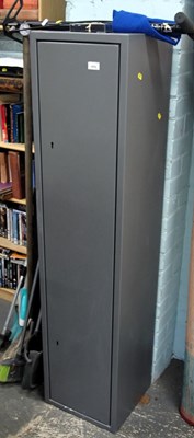 Lot 1575 - A lockable grey metal gun cabinet, 47cm high,...