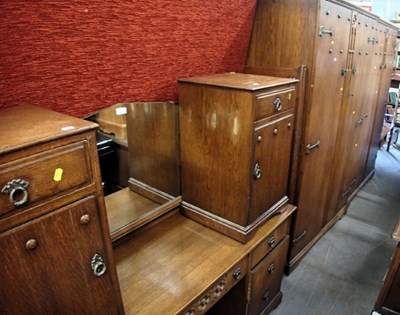 Lot 1601 - A group of oak bedroom furniture, in the Arts...