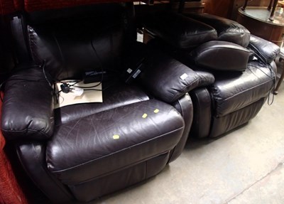 Lot 1603 - A pair of electric reclining black leather...