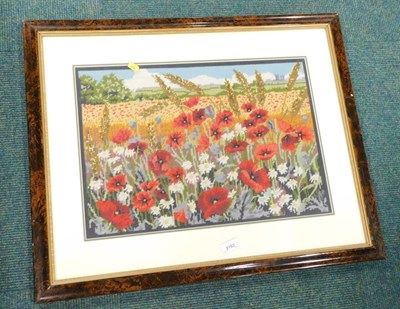 Lot 2153 - An embroidered picture depicting a field of...