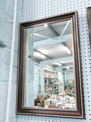 Lot 2177 - A mahogany framed rectangular wall mirror,...