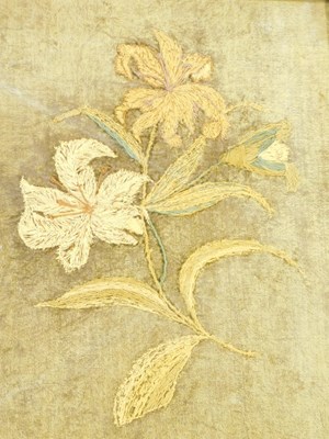 Lot 570 - A silk embroidered picture of flowers, on a...