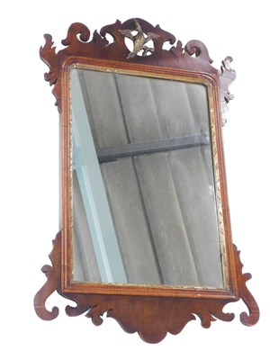 Lot 571 - A mahogany fret framed wall mirror, in mid...